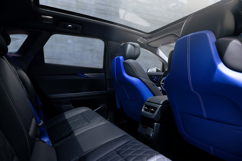 Back Seat View of the 2026 OPTIQ-V Blue Front Seats, Sun Roof, and Interior | Courtesy Cadillac Broussard in Broussard LA